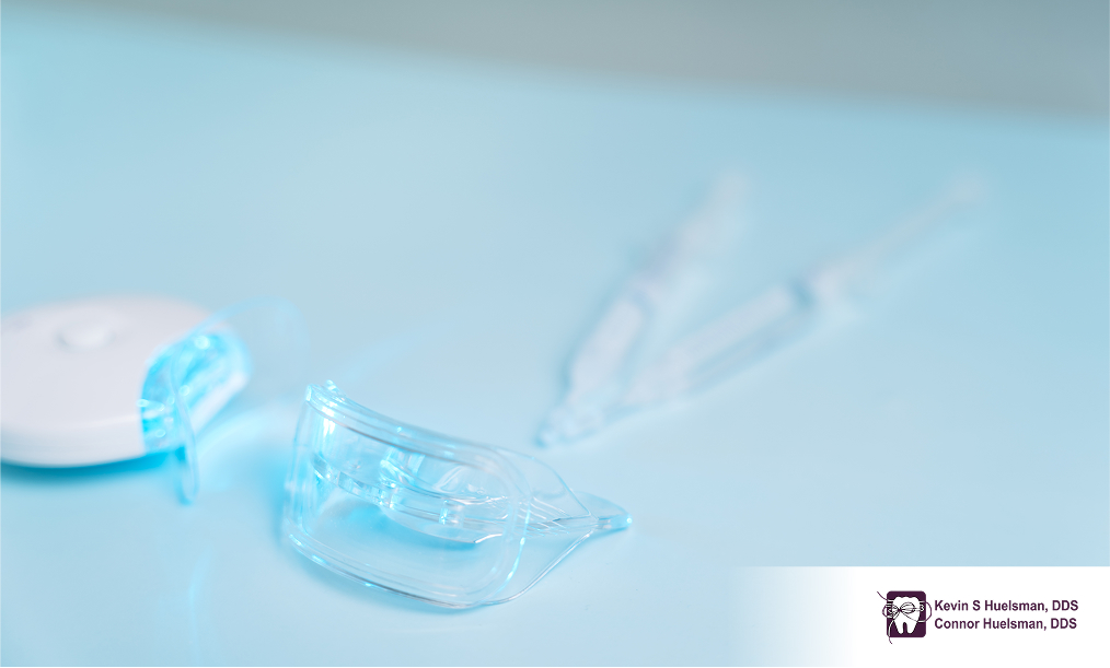 Teeth whitening trays with gel syringe on table